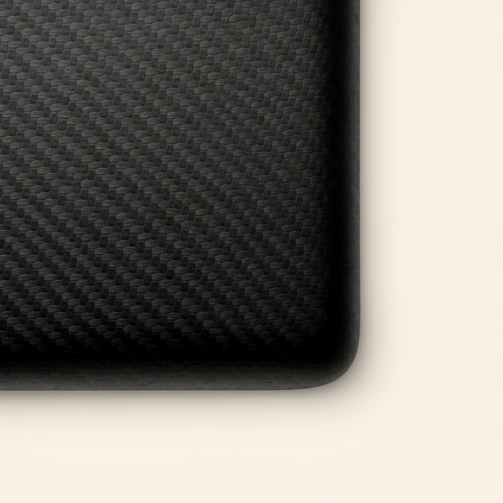 A black panel with a rounded corner featuring a woven carbon fiber texture.